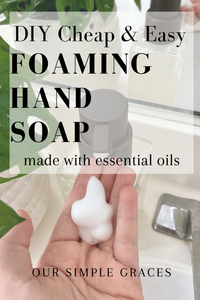 foaming hand soap in womans hand on bathroom sink counter with text written over image that reads DIY Cheap & Easy Foaming hand soap made with essential oils our simple graces
