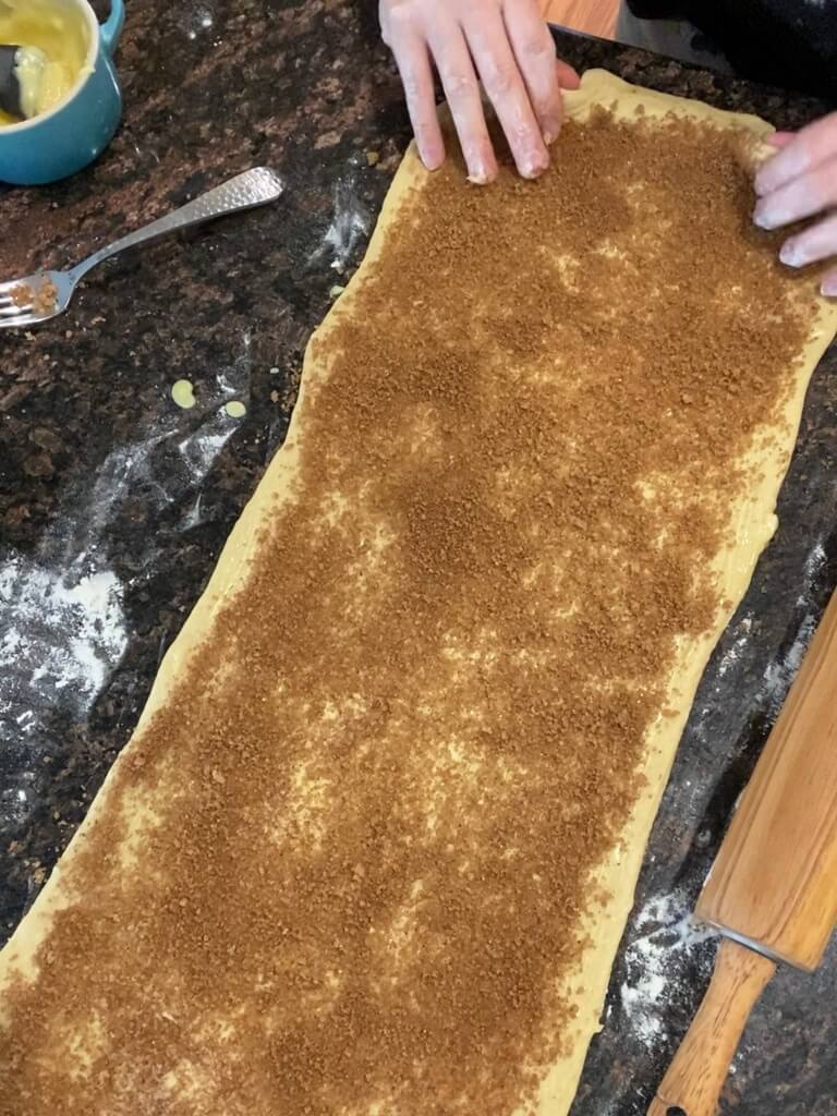 brown sugar cinnamon on sourdough brioche dough on counter