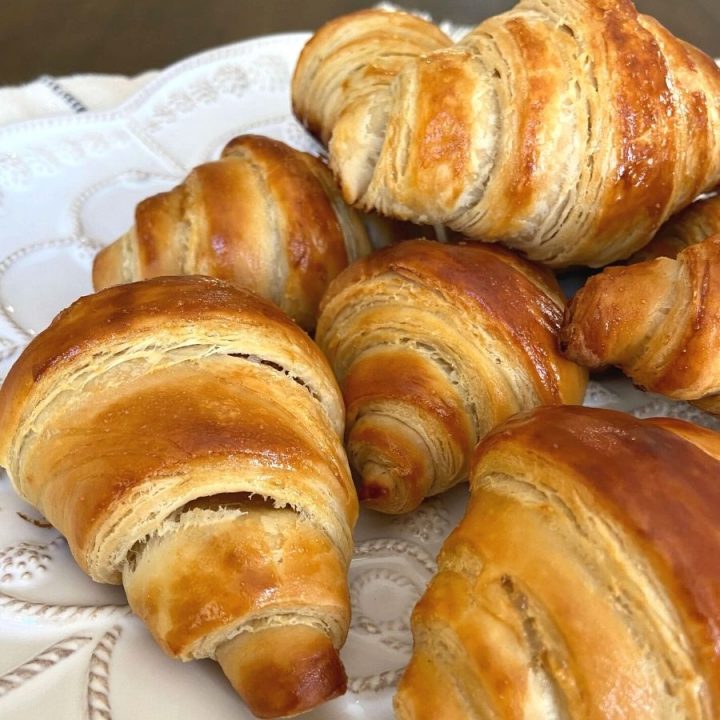 This sourdough croissants recipe yields delicious flakey, buttery sourdough croissants that will take you straight to a Parisian café.
