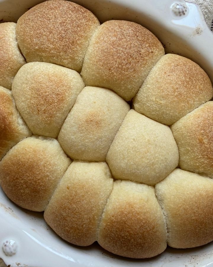 These are the best sourdough rolls - light and fluffy, slightly sweet and deliciously buttery. These rolls use sourdough starter and no yeast and will give Sister Schubert a run for her money!