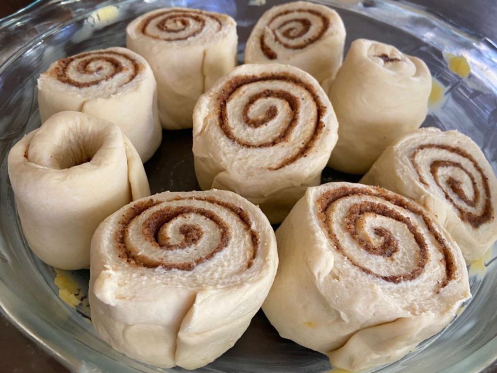 cinnamon rolls sourdough in pie dish before baking